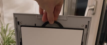 You need to remove the white cover on the lid. It’s only for paper copies.