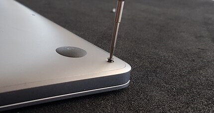 One of what feels like 1000 screws on the Mac Book.